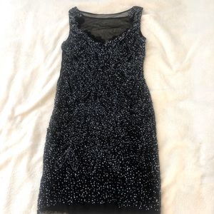 Fully lined stunning black sequins short dress.  Size 6.